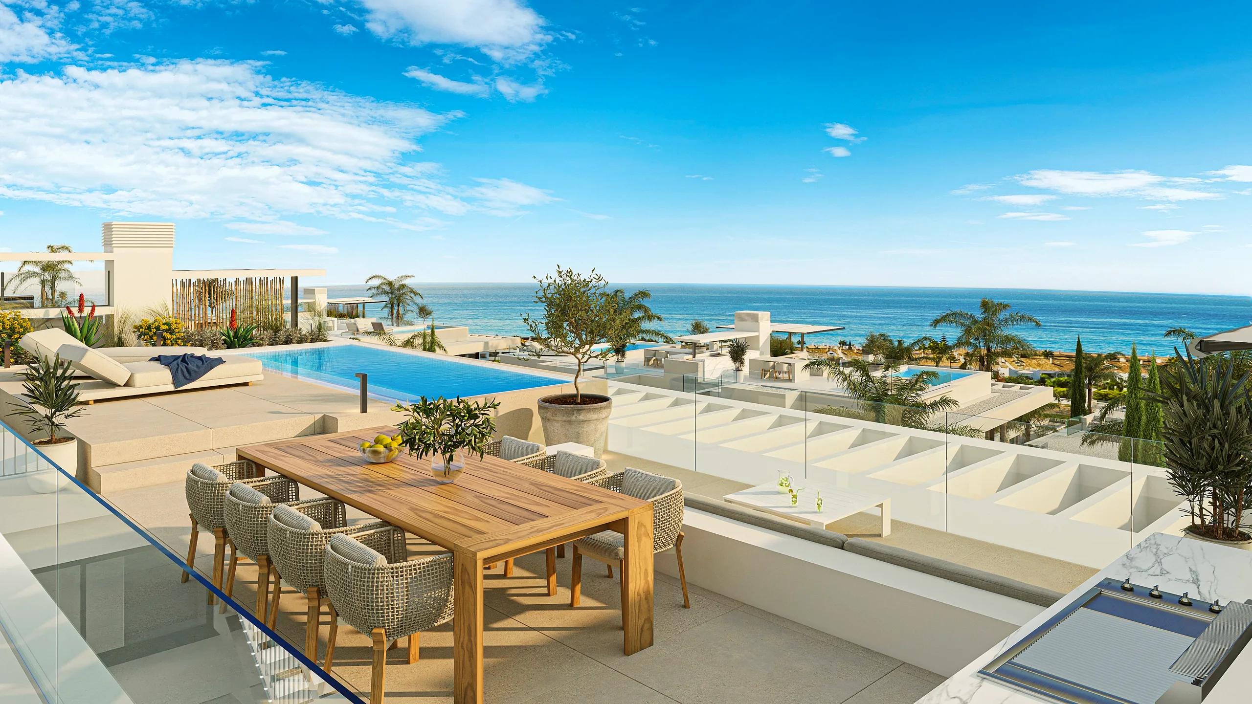 Rooftop terrace with a dining table, pool and sea view