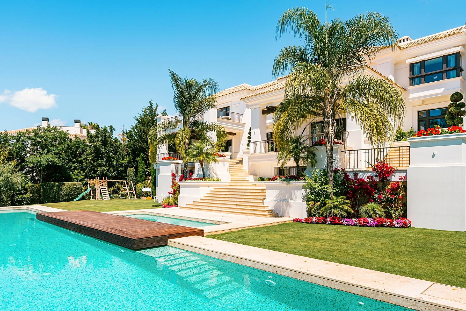 Andalusian villa with a pool and palm trees in the garden