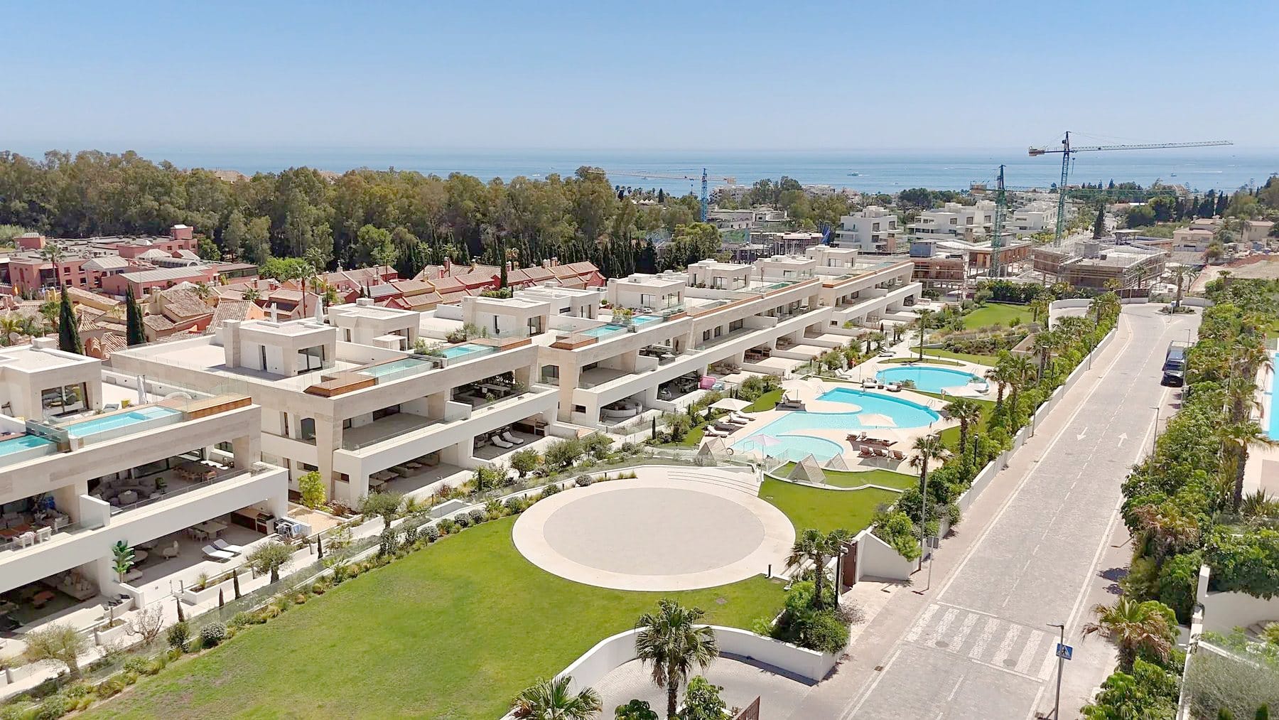 Finished apartment buildings with swimming pools and a garden