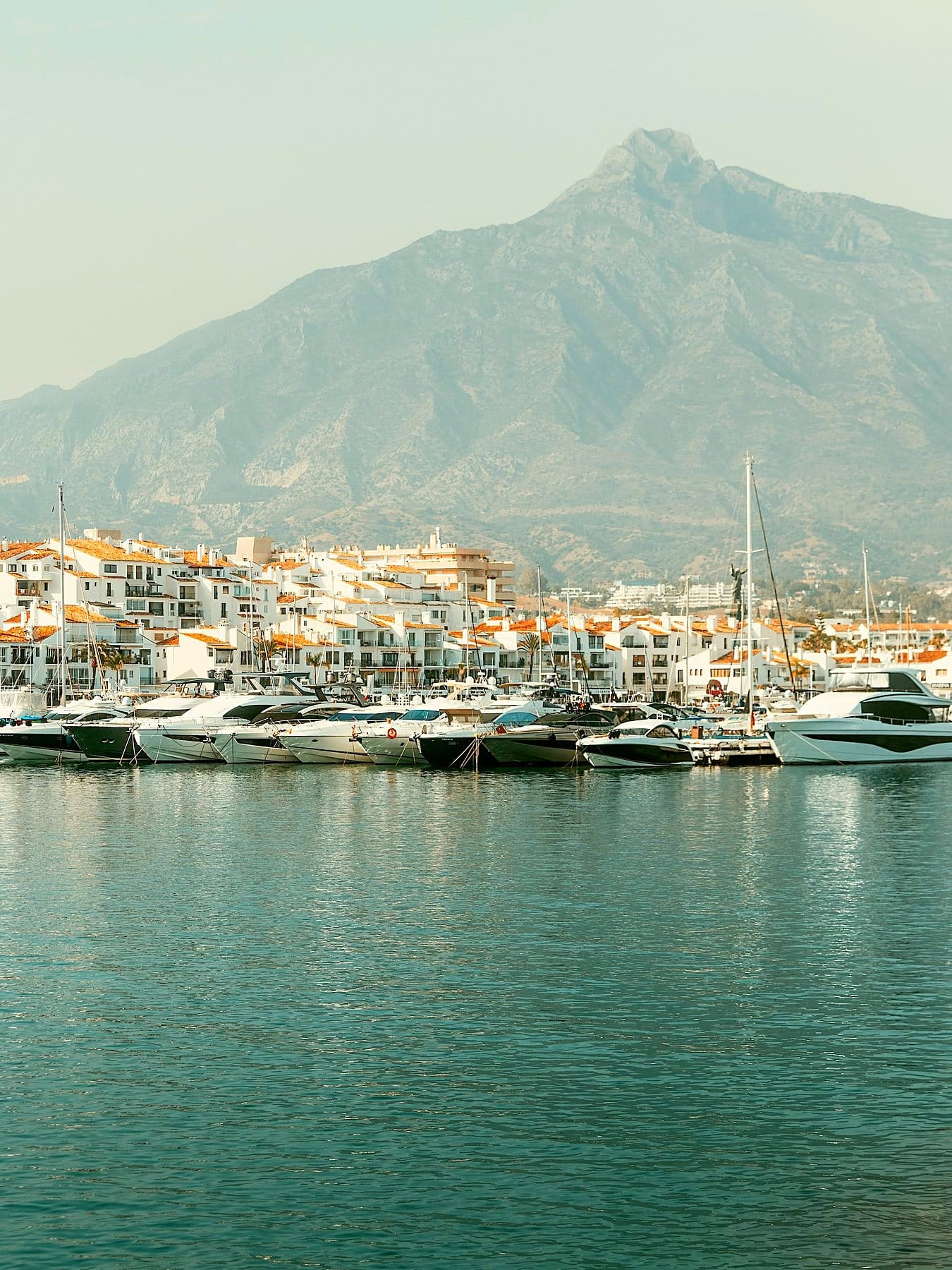 Yachts in Puerto Banús marina with La Concha mountain in the background