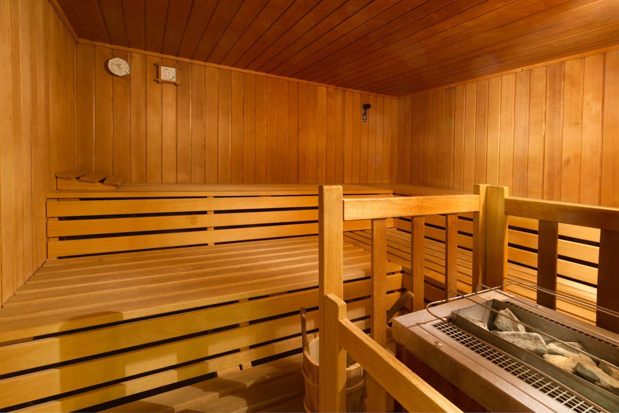 Wooden sauna with benches and a stove – Marbella